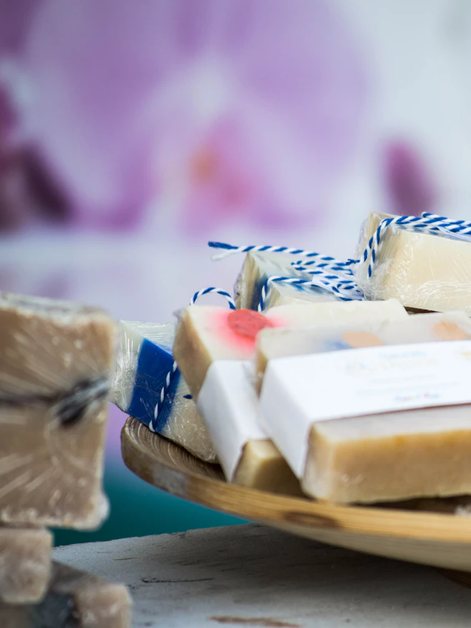 Wrapped bars tied with baker’s twine on a wooden plate